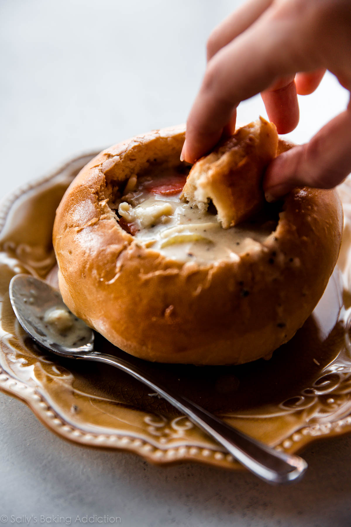 How to make crusty and soft homemade bread bowls with step by step pictures. This is a delicious basic dinner roll recipe you should hold onto! Recipe on sallysbakingaddiction.com